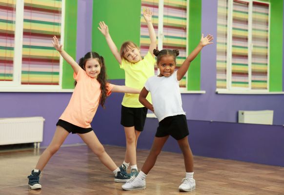 Cute little girls dancing in choreography class